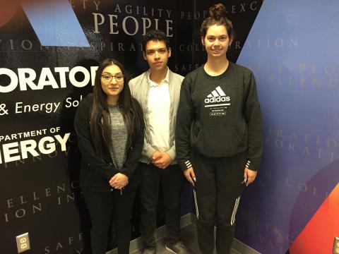image of three people standing 