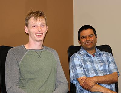 image of two people seated: CMI project lead Durga Paudyal (right) is mentoring Iowa State University doctoral student Gavin Nop (left) through the U.S. Department of Energy Office of Science Graduate Student Research (SCGSR) Award.